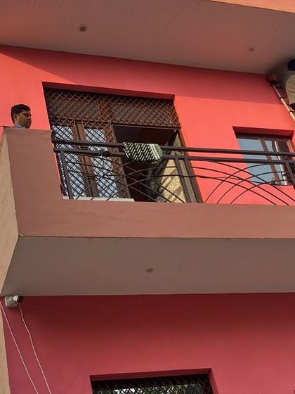 A residential installation in progress at a home in Ghaziabad. My team uses ladders and proper equipment to safely install cameras at optimal heights for covering balconies and entry points.