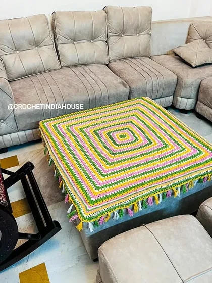 The square table mat shown in its home setting. It demonstrates how a custom crochet piece can tie a room together and add personality.