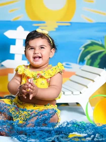 Pure happiness at her own private beach party. Her joyful expression is what these themed photoshoots are all about.