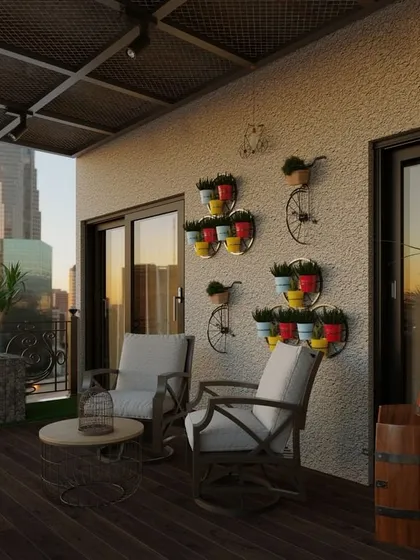 A day-time view of the rustic balcony, showing how the gabion planters and wooden barrel table contribute to the countryside vibe against the modern city backdrop.
