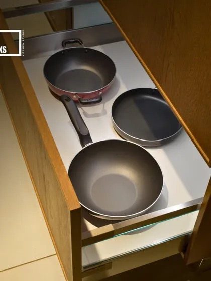 Deep drawers are essential for storing pots and pans. We ensure they are sturdy and pull out fully for easy access.
