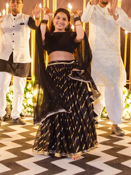 A candid shot of us leading a performance at a real sangeet night. Our goal is to make you feel so comfortable and confident that you get lost in the music and have the best time on the dance floor.