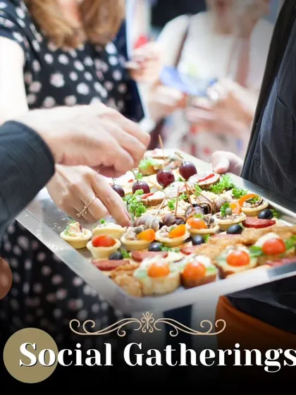 We cater to all types of social gatherings. This image of guests enjoying canapés from a platter demonstrates how we handle everything from intimate parties to large celebrations with equal care.