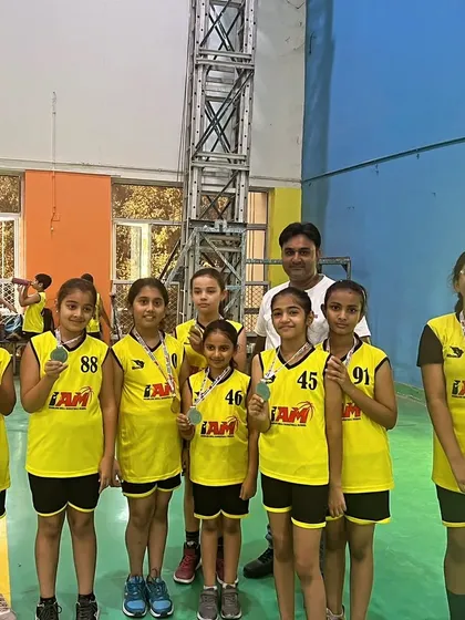 Our girls' team proudly showing off their medals from the Inter-Society Tournament.
