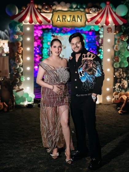 Another lovely portrait of the couple at their outdoor event. This image captures their happy expressions and the celebratory atmosphere of the day.
