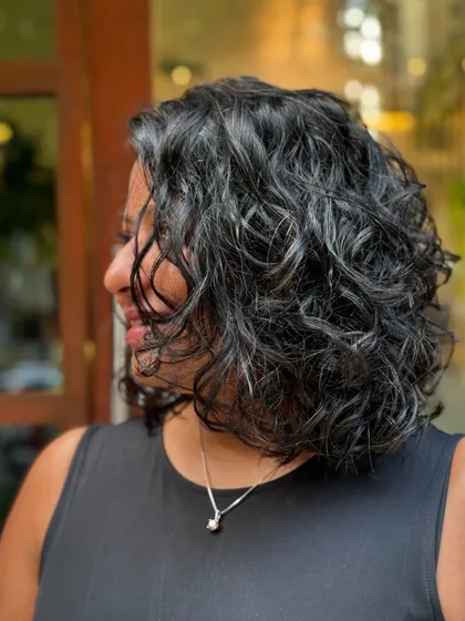 More examples of my short curly haircuts, from bobs to layered chops, each one personalized to the client's curl pattern and face shape.