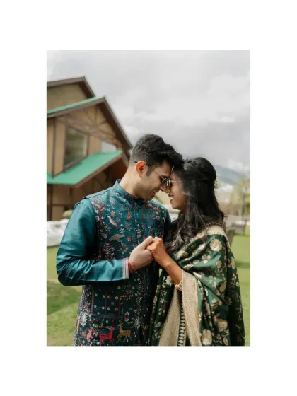 An intimate moment during a Mehendi ceremony in the snowy landscapes of Manali. The contrast between the cold setting and their warm connection is what makes this destination wedding portrait special.