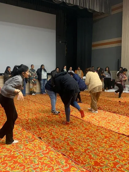 Teachers at Heritage International Xperiential School participating in a physical activity, learning how movement and play are integral to storytelling.