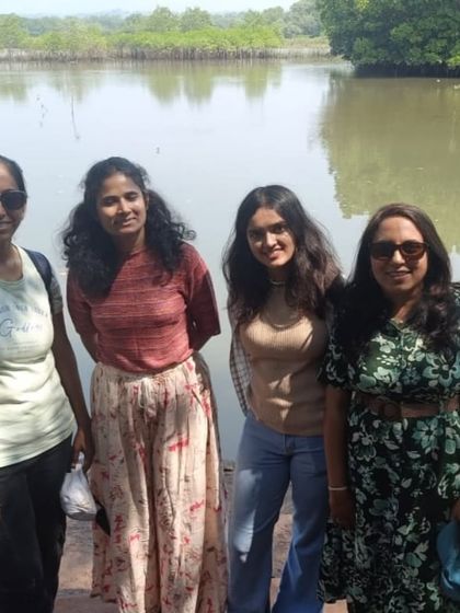 A group of friends posing by the backwaters. The coastal trek is as much about the people as it is about the views.