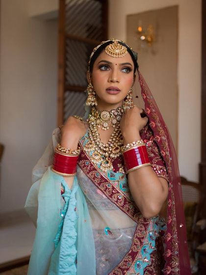 A beautiful portrait showing the full effect of the makeup with the stunning layered jewellery. The look is both traditional and unique.