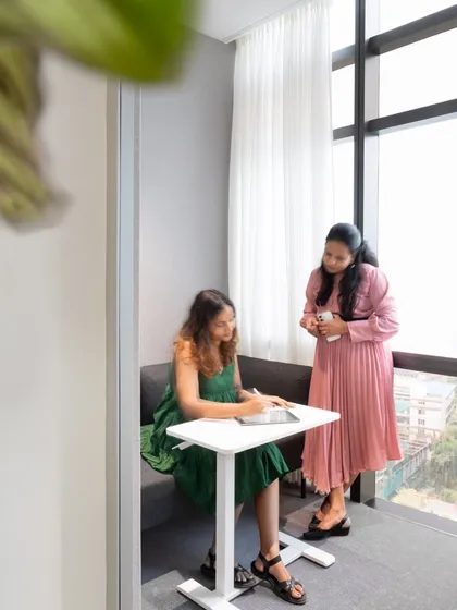 A cozy nook in our office with built-in seating, perfect for a quick chat or focused work away from a desk.