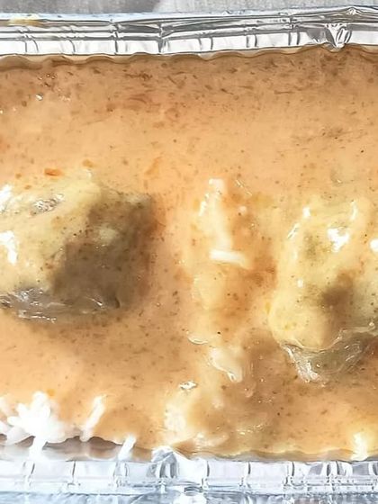 A single serving of my Kadi and Rice combo. The tangy and spicy yogurt-based curry with gram flour dumplings is a true delight.