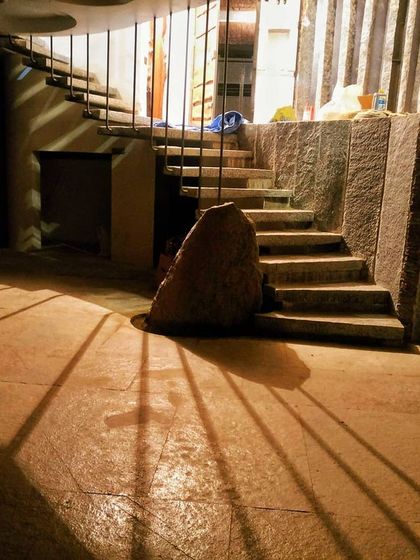 This is where stone and shadow create drama. We used a large, natural boulder as an anchor for this stone staircase, and the strategic lighting casts long shadows, turning a simple flight of stairs into a powerful architectural statement.