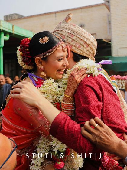 A hug full of happiness and emotion between the bride and groom right after their wedding ceremony.