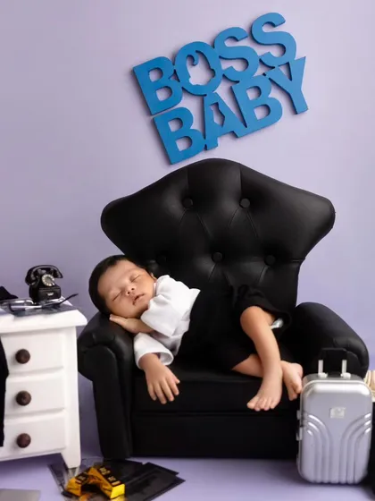 Reporting for duty! This 'Boss Baby' themed newborn shoot is a fun and creative way to announce your new arrival. My studio is stocked with unique props to bring your vision to life.