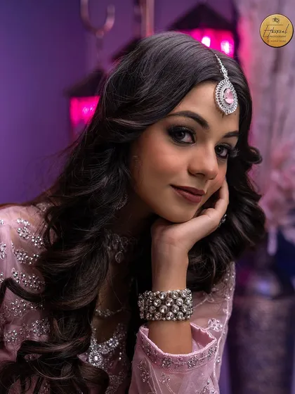 A classic portrait that focuses on elegance and detail. This image highlights my ability to work with soft lighting to capture flawless makeup, intricate jewelry, and the model's graceful expression for a timeless look.