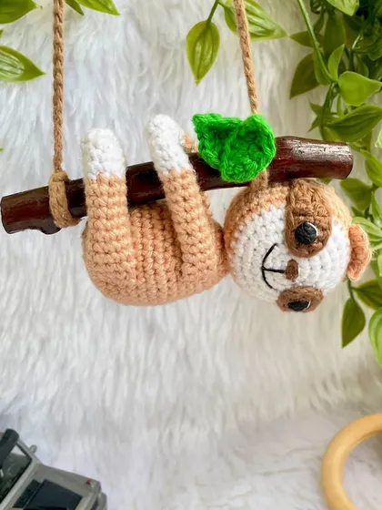 This adorable sloth car hanging was so much fun to make. He hangs lazily from a real wooden branch, adding a touch of cuteness to your car's rearview mirror.