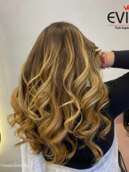 A classic balayage is timeless for a reason. Here, I've blended warm caramel and blonde tones into her natural base to create these beautiful, sun-kissed waves. The result is a rich, multi-dimensional color that looks effortlessly gorgeous.