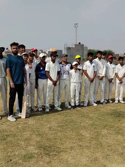Our team of young, dedicated cricketers with one of our coaches. We work to build a strong sense of community and discipline, creating a supportive environment where every player is mentored and encouraged to reach their full potential.