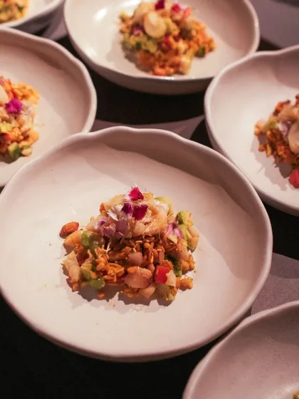 My culinary creations extend beyond the grazing board. This is a gourmet take on jhalmuri, featuring poached lobster and a special masala mix, served as an elegant small plate to surprise and delight guests.
