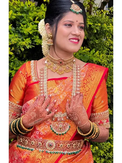A complete bridal look featuring a layered Kempu haram, choker, and matching oddiyanam (waist belt). I help you mix and match pieces to create your dream wedding style.