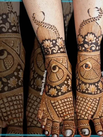 An intricate design for a bride's feet, featuring lotus and peacock motifs. The pattern extends up the ankle in a beautiful vine.