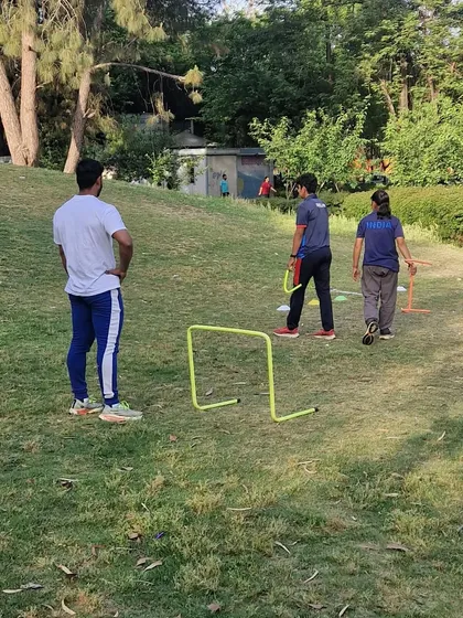 Observing my athletes as they perform their drills. It's important for me to monitor their form and provide immediate feedback.