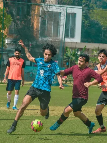 Players battle for possession in the midfield. Our corporate tournaments are filled with moments of intense, competitive action from start to finish.