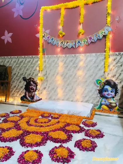 The seating area for the baby, decorated with a marigold arch and a backdrop of twinkling lights. It’s a simple yet beautiful setup for the main ritual.