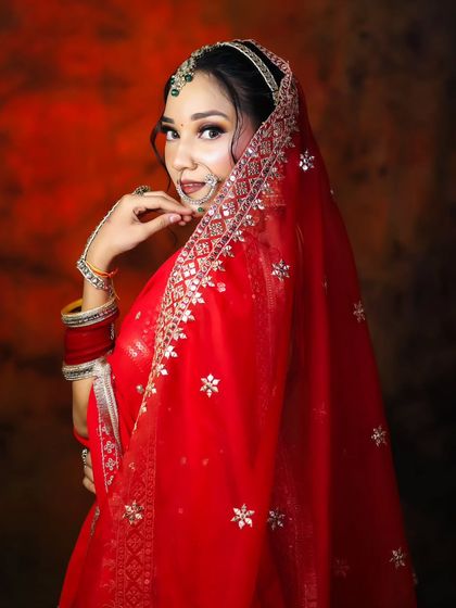 A classic red bridal look is a staple in any makeup artist's portfolio. Our students master this iconic style, ensuring a flawless and timeless result.