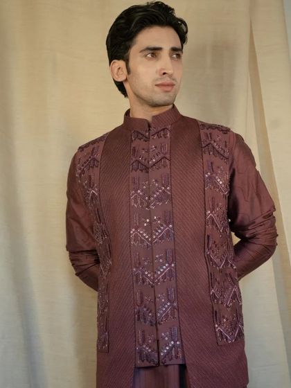 A perfect choice for an elegant evening event, this kurta set combines traditional materials with a modern, structured design.