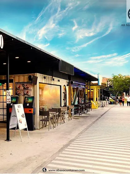We can create entire streets of container-based retail and dining spaces. This concept shows a bustling bistro and outdoor seating area, perfect for food parks and commercial complexes.
