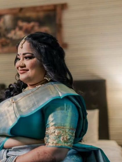 A comfortable and happy portrait in her hotel room. The makeup is soft and elegant, perfect for a long evening of celebrations.
