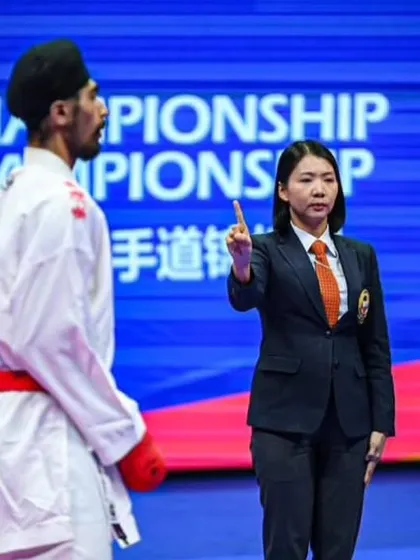 A referee's call during the Asian Championship. Understanding the rules and how points are scored is a critical part of competitive training that I cover in detail.