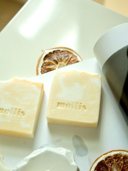 The creamy white and yellow swirls of the Orange & Bergamot soap.