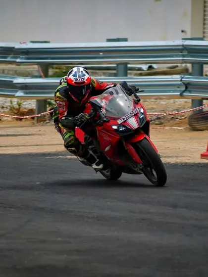 A rider on an Apache RR 310 navigates a cone drill during a personal training session.