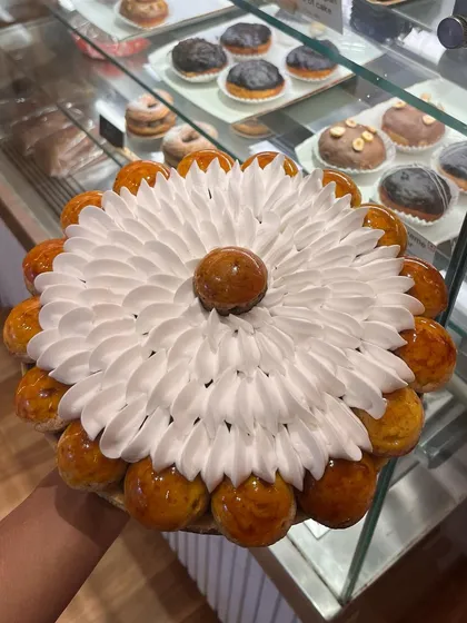 A throwback to this huge St. Honoré cake we made. This classic French pastry consists of a ring of puff pastry topped with cream puffs dipped in caramel and filled with a light pastry cream.