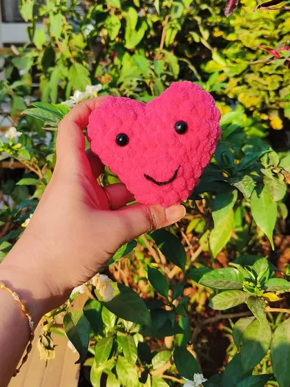 A fun and sweet version of our crochet heart, complete with a little smile. This plushie is a cheerful and adorable keepsake that is sure to make anyone happy.