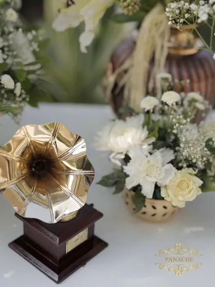 A close-up of the miniature gramophone prop, adding a touch of vintage charm to the decor.