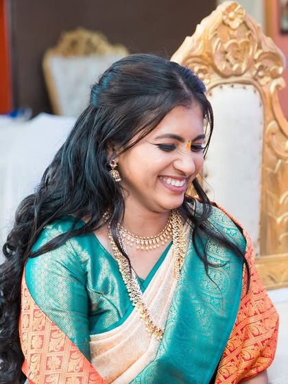 A bride's happy and gentle smile during her wedding ceremony.