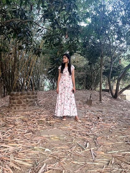 Standing in a clearing surrounded by bamboo and other trees. The feeling of being enveloped by nature is incredibly calming.