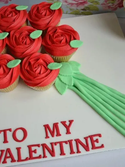 This is where edible meets art. I crafted this unique bouquet from a set of vanilla cupcakes with intricate red rose frosting, offering a delicious and creative alternative to traditional flowers for Valentine's Day or anniversaries.