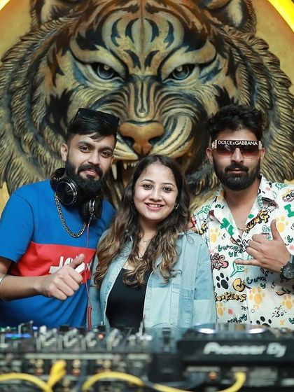 Posing with a fan at the DJ booth.