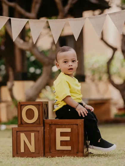 A sweet, direct-to-camera portrait from a first birthday session. These simple, classic shots beautifully capture your baby's features at this milestone age.