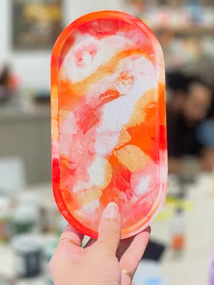 A vibrant and fiery abstract resin tray. The way the colors blend and create unique patterns makes every resin piece a one-of-a-kind work of art.