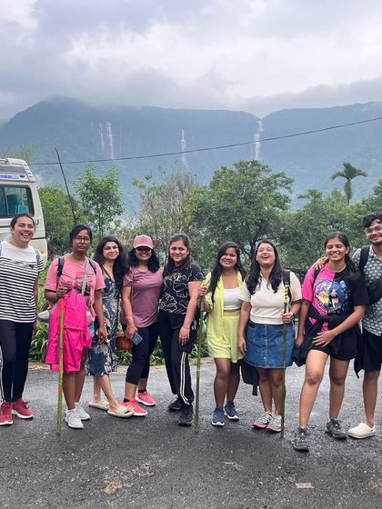 A group of friends ready for a trek in Meghalaya, with the famous seven sisters falls in the background. I provide all the support needed for a safe and enjoyable trek.