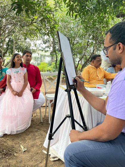 Here I am in action, sketching a family at the beautiful Ecoville resort. It's an interactive experience for everyone involved.