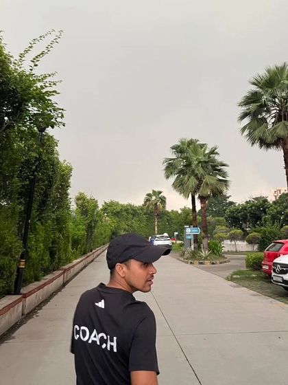 Wearing my 'COACH' shirt outdoors.