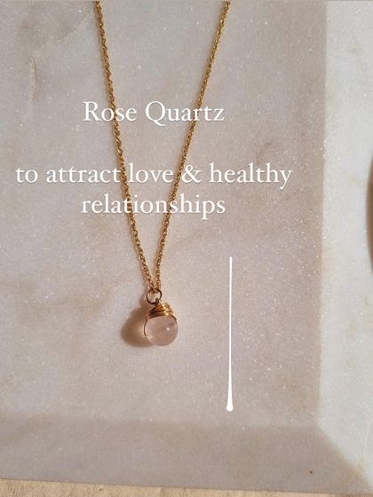 This wire-wrapped Rose Quartz pendant is designed to help you attract love and healthy relationships. The simple design keeps the stone's energy close to your heart, reminding you of your intention throughout the day.