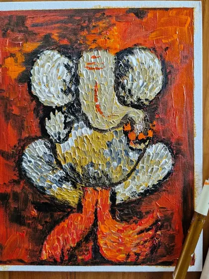 A textured painting of Lord Ganesha created using a nib and palette knife with acrylics. This technique allows for a unique, almost sculptural feel, making it a vibrant addition to a home altar or as a spiritual gift.
